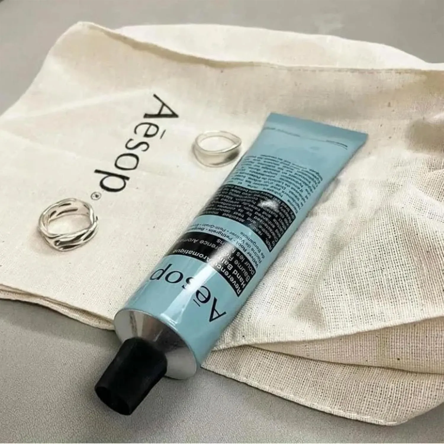 Aesop Reverence Aromatique Travel Size Hand Balm | Lotion that Gently Exfoliates Dry Hands   Nourishes with Macadamia Seed Oil and Shea Butter | 2.4 oz / 75 mL (Pack of 2)